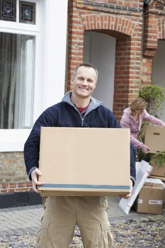 Professional house movers handling a Glasgow home move with boxes and furniture