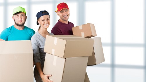 Careful unloading of boxes and furniture at a Glasgow destination