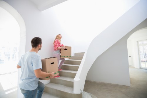Professional movers handling boxes and furniture in Glasgow