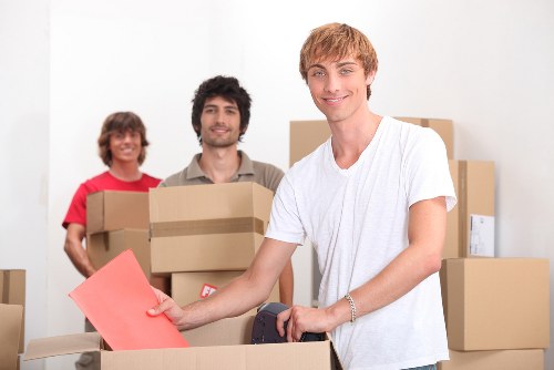 Packed office equipment and furniture prepared for a commercial move in Glasgow